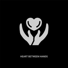 white heart between hands vector icon on black background. modern flat heart between hands from general concept vector sign symbol can be use for web, mobile and logo.