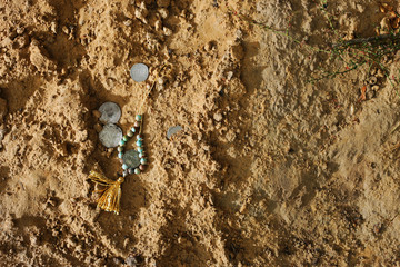 Silver coins in the sand
