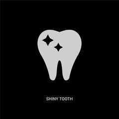 white shiny tooth vector icon on black background. modern flat shiny tooth from dentist concept vector sign symbol can be use for web, mobile and logo.