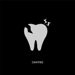 white cavities vector icon on black background. modern flat cavities from dentist concept vector sign symbol can be use for web, mobile and logo.