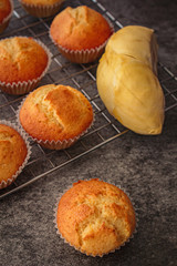 Homemade durian cupcakes on rock table.