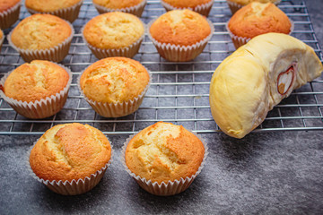 Homemade durian cupcakes on rock table.