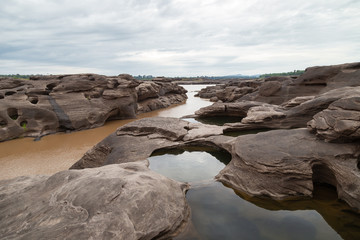 River Island. Rocks from water erosion. 