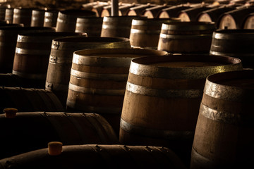 old barrels of wine in a cellar