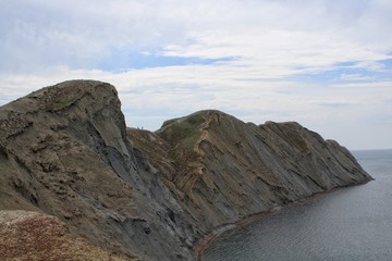 Rock near the sea. Mountain near the sea. Cape Сhameleon.
