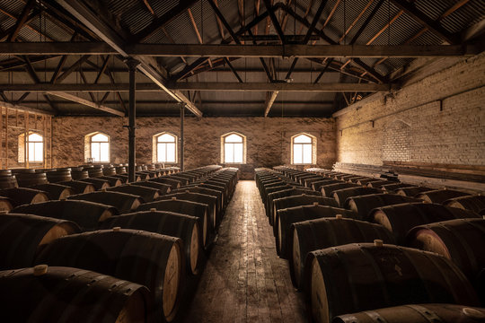 old barrels of wine in a cellar