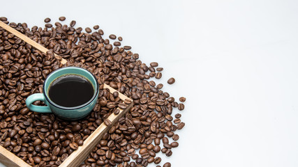 cup of coffee and beans on white background with text space