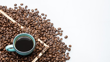 cup of coffee and beans on white background with text space