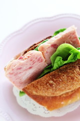 Homemade French bread and luncheon meat sandwich