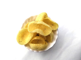 yellow eating snacks for children in white bowl