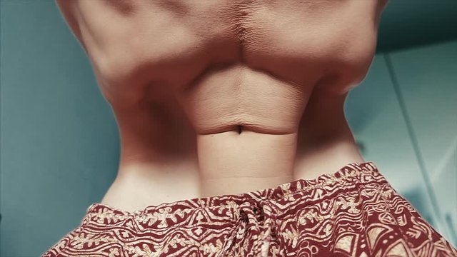 Loopable seamless footage of a young man doing Nauli Kriya yoga exercise. Clip is non linear in time and contains slow motion and accelerated time intervals