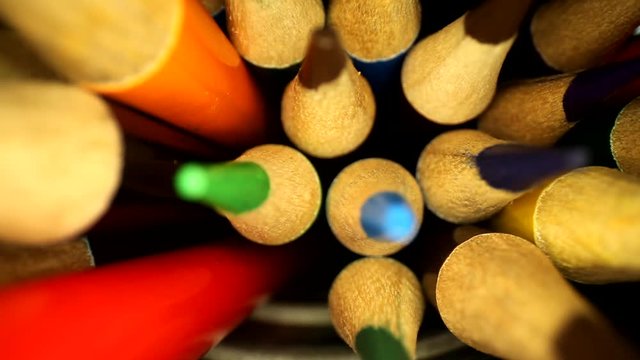 Moving away from the tips of colored pencils. Narrow focus where the shaved portions roll towards the tips. Using a wide angle probe lens to get a unique perspective.