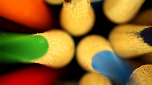Quickly moving towards a jar of colored pencils. Very narrow focus to reveal the tips and portions of the wood; jostling them at the end. Using a wide angle probe lens to get a unique perspective.