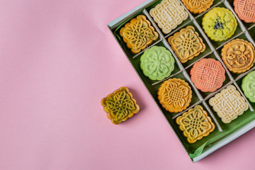 Mid Autumn Festival concept - yuebing monncakes on pastel background, top view