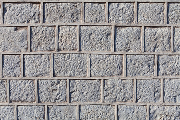 Graven stone blocks or bricks surface with cement grout