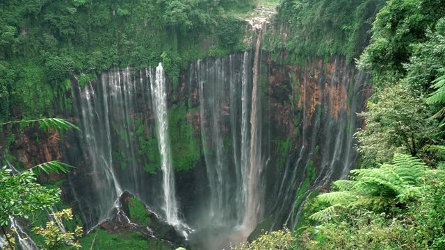 Coban Sewu or Tumpak Sewu Waterfalls in slow motion, the most beautiful waterfall located in Lumajang, East Java, Indonesia.