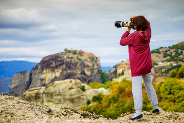 Woman take photo from Meteora monastery