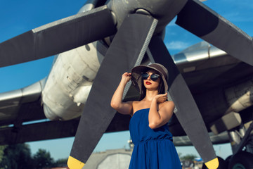 Brunette in a dress at the old airport