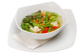 Vegetable soup in bowl on a white isolated background