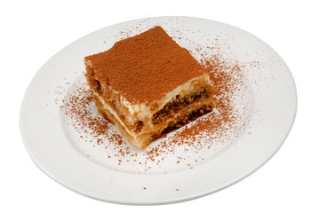 Slice of delicious cake on a white plate on white isolated background