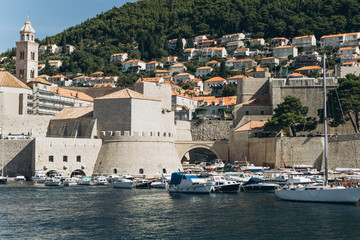 Fototapeta na wymiar Beautiful view of traditional old buildings and boats in the old town in Dubrovnik in Croatia.