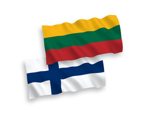 National vector fabric wave flags of Lithuania and Finland isolated on white background. 1 to 2 proportion.