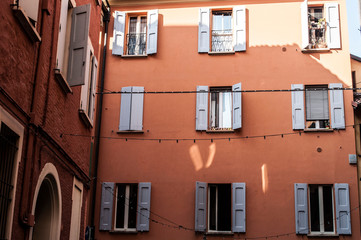 Pattern facade of building with windows and shutters italian architecture Tuscany Italy