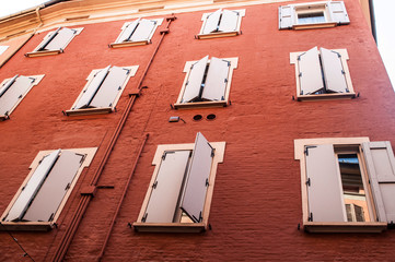 Pattern facade of building with windows and shutters italian architecture Tuscany Italy