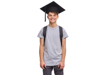 Young graduate student - Happy teen boy in bachelor hat with backpack, isolated on white...
