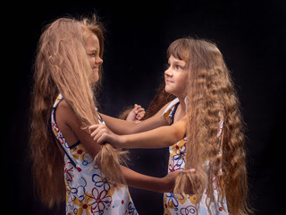Girl grabbed another girl by the hair