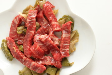 Chinese cooking, beef and szechuen pickles prepared on dish
