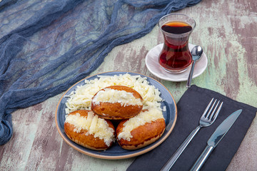 Traditional Turkish pastry pogaca with cheese filling. Turkish name: Sakalli, sacakli, corek -...