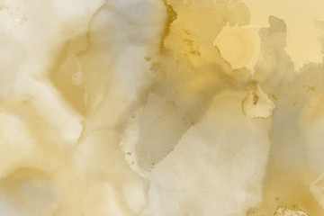 Hand painted gold alcohol ink background. Abstract delicate yellow texture. Contemporary wallpaper. 