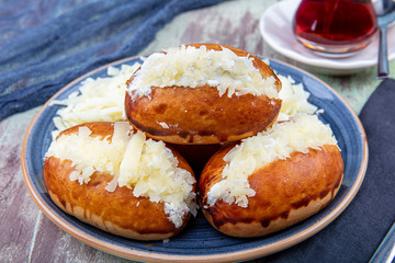 Traditional Turkish pastry pogaca with cheese filling. Turkish name: Sakalli, sacakli, corek -...