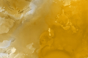 Hand painted gold alcohol ink background. Abstract delicate yellow texture. Contemporary wallpaper. 