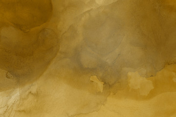 Hand painted gold alcohol ink background. Abstract delicate yellow texture. Contemporary wallpaper. 