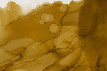 Fototapeta na wymiar Hand painted gold alcohol ink background. Abstract delicate yellow texture. Contemporary wallpaper. 