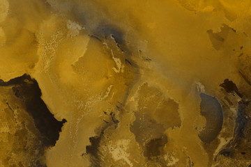 Hand painted gold alcohol ink background. Abstract delicate yellow texture. Contemporary wallpaper. 
