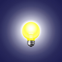 Shining light bulb on dark background