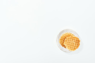 top view of pate with waffles on plate on white