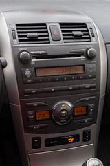 Car interior, radio and air ventilation.