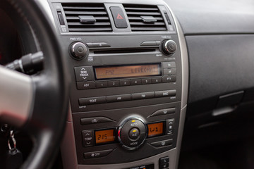 Car interior, radio and air ventilation.