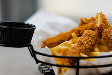 Cajun basket with sauce and chips