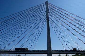 Cable-stayed bridge on the Vistula river. Cars passing the bridge. Gdansk/Poland
