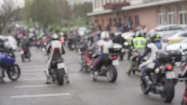 Bllured shot of many motorbikes leaving
