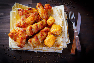 Grill dishes, kebab for the restaurant menu. Wooden background. Chicken meats and pita bread