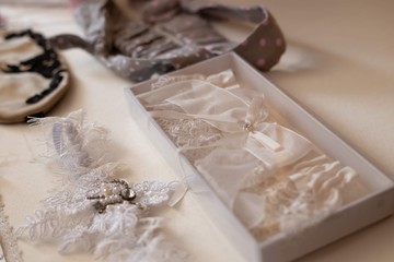 bride's garter with ornaments in boxes