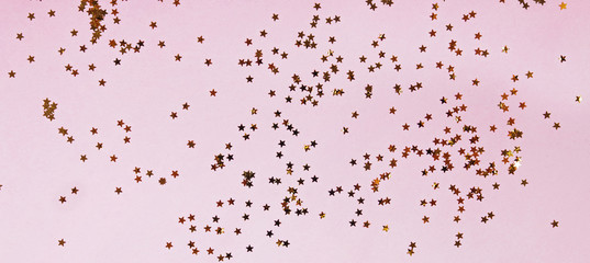 Backdrop with golden star shaped confetti