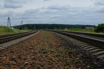 Railway stones at railroad track. Landscape with sky. Outskirts of Vitebsk, Belarus