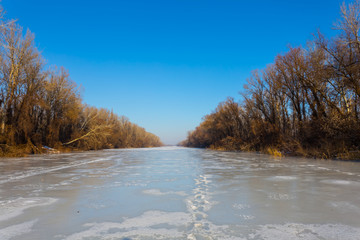 Fototapeta premium frozen river landscape at the bright cold winter day